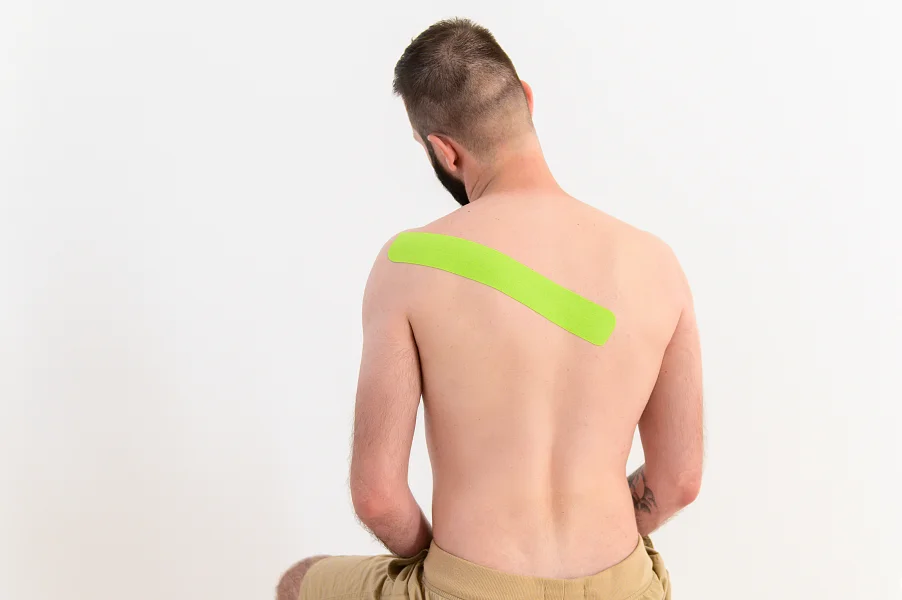 Подробная схема аппликации кинезиотейпом при боли в спине. Вариант 2